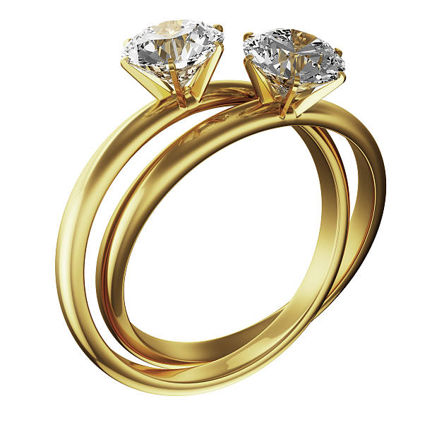 istock Gold diamond rings intertwined against a white background 93462761