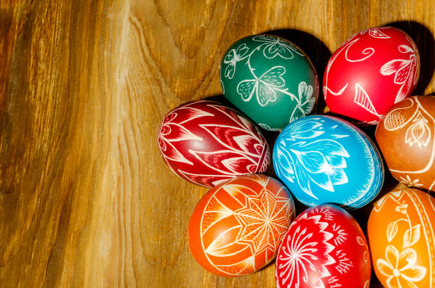 istock colorful scratched handmade Easter eggs on a wooden table 934633792
