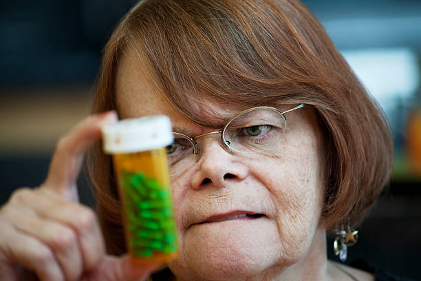 istock Senior woman with medicine bottle 93463591