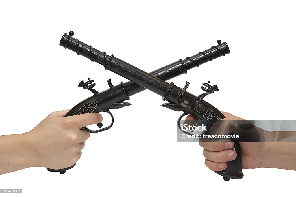 Dos manos con un viejo pistols - Foto de stock de Anticuado libre de derechos