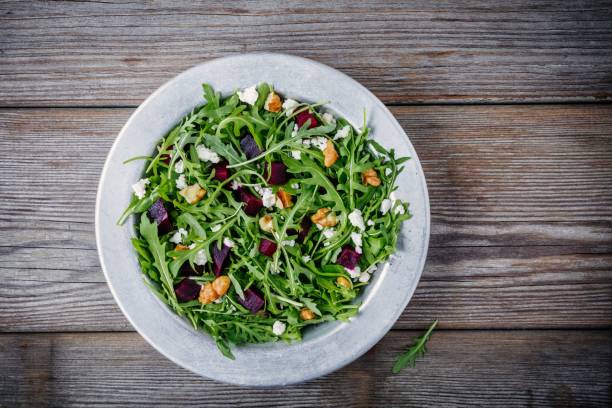 istock Fresh green salad with arugula, beets, walnuts and goat cheese 934636904
