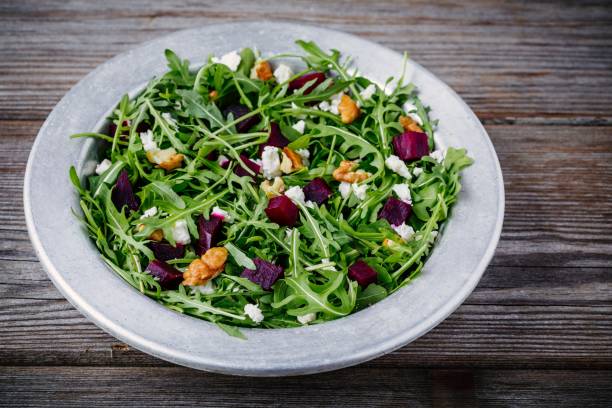 istock Fresh green salad with arugula, beets, walnuts and goat cheese 934636984