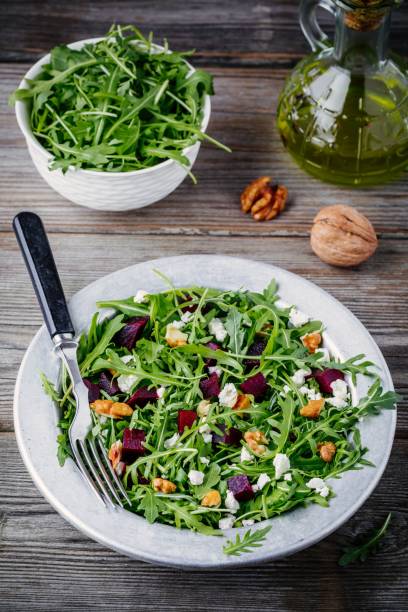 istock Fresh green salad with arugula, beets, walnuts and goat cheese 934636994