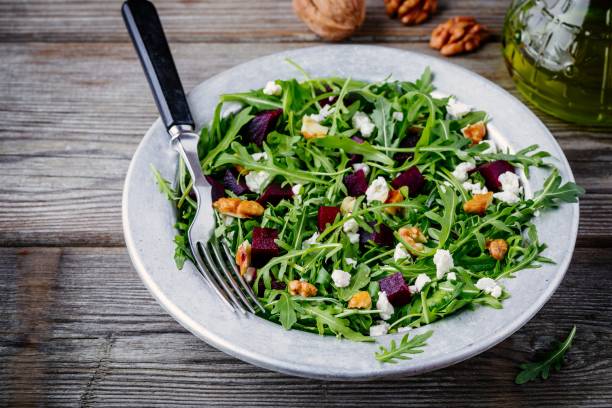 istock Fresh green salad with arugula, beets, walnuts and feta cheese 934637018