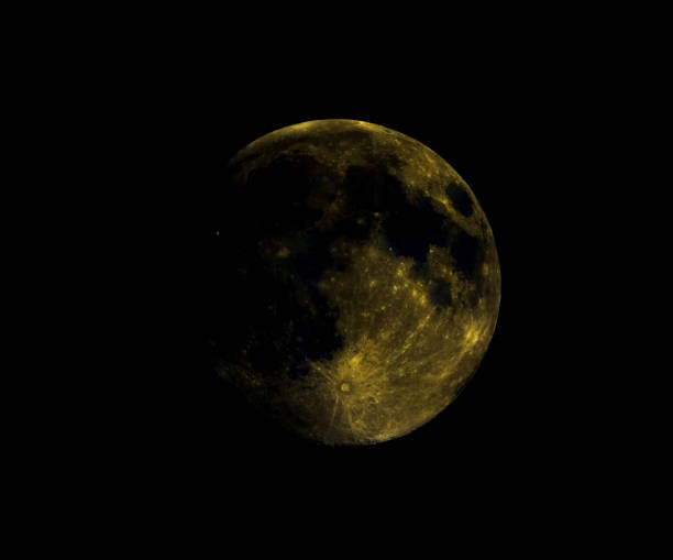 istock High contrast Full moon seen with telescope, enhanced colours 934639756