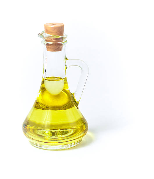 istock Olive oil in glass bottle or container with cork 93464119