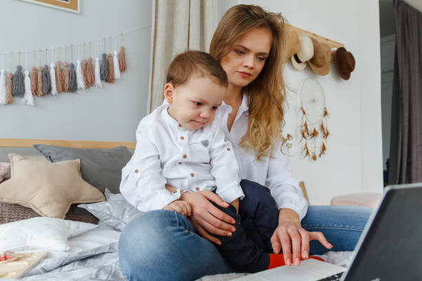 istock Mom and the kid with a laptop 934642824