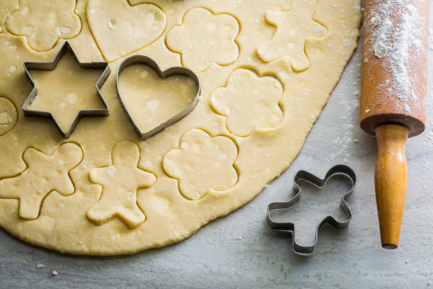 istock Preparation for baking tasty butter cookies on gray table 934643432