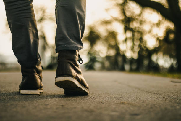 istock Picture of brown leather boots on road 934646440