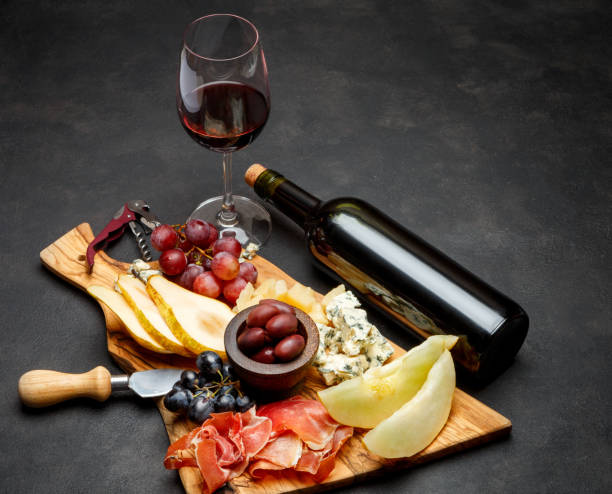 istock Meat plate antipasti snack - Prosciutto ham, blue cheese, melon, grapes, Olives 934652188