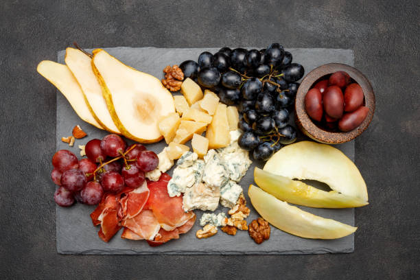 istock Meat plate antipasti snack - Prosciutto ham, blue cheese, melon, grapes, Olives 934652316