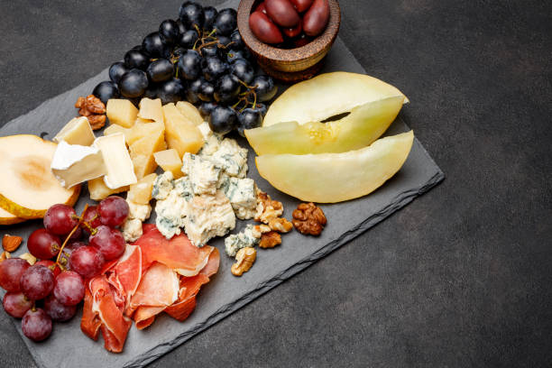 istock Meat plate antipasti snack - Prosciutto ham, blue cheese, melon, grapes, Olives 934652426