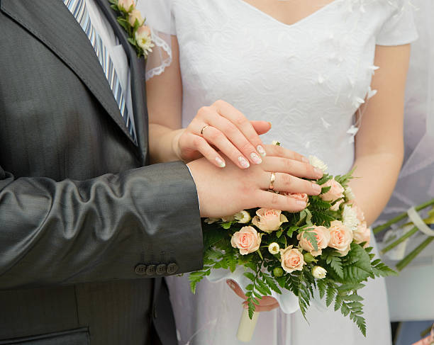 istock Hands of a newly-married couple 93465473