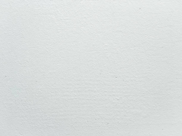 istock Grungy painted wall texture as background. Cracked concrete vintage wall background, old white painted wall. Background washed painting. 934654938
