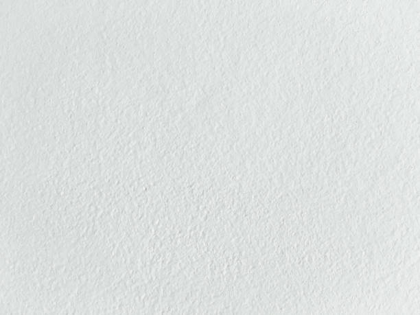 istock Grungy painted wall texture as background. Cracked concrete vintage wall background, old white painted wall. Background washed painting. 934654986