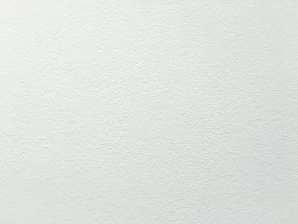 istock Grungy painted wall texture as background. Cracked concrete vintage wall background, old white painted wall. Background washed painting. 934654994