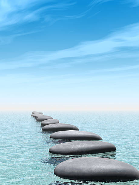 istock A path of smooth rocks across some water 93465602