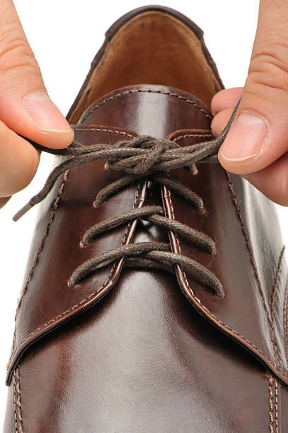 istock To fasten bootlace on shoes 93465706