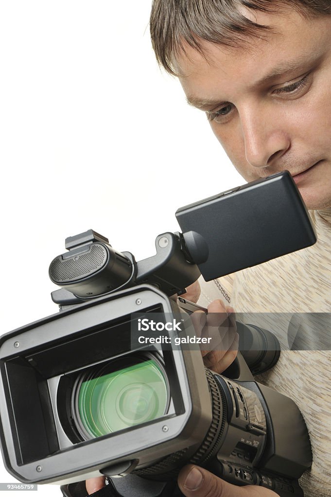L'uomo con una videocamera - Foto stock royalty-free di Adulto