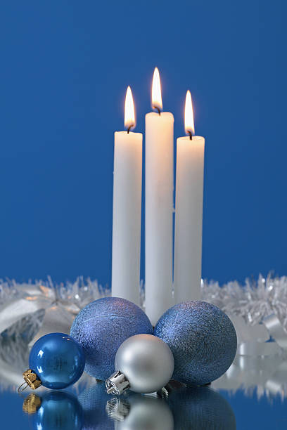 istock christmas balls and burning candles 93465875