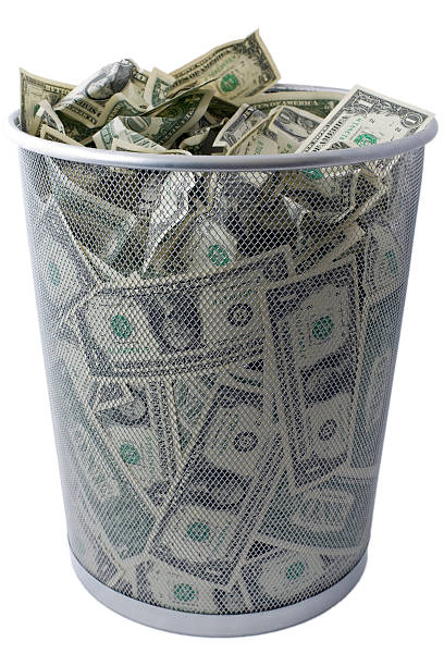 istock US dollar USD $ trash - US economy trashcan concept 93465906