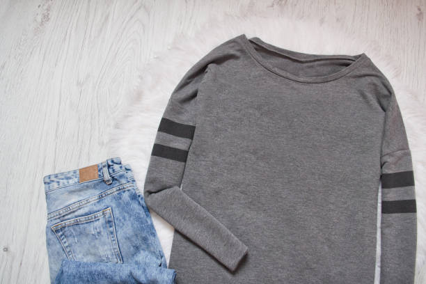 istock Gray sweatshirt and  jeans. Fashionable concept 934659164