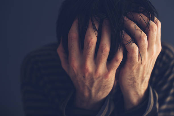 istock Hopeless drug addict holding his head 934666814