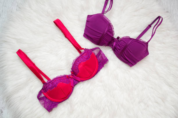 istock Two colored bra on white fur. Fashion concept 934666972