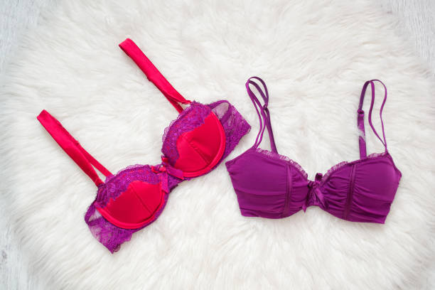 istock Two colored bra on white fur. Fashion concept 934666992