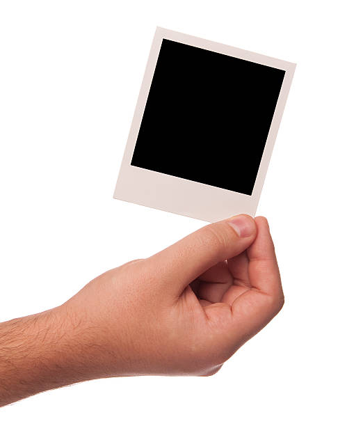 istock man hand with polaroid photo 93466752
