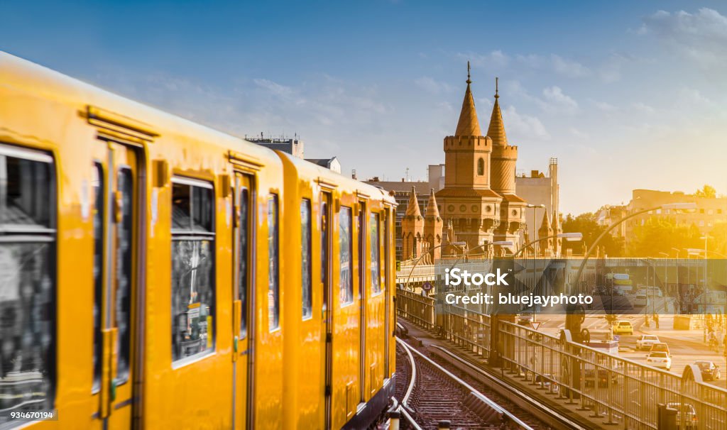 U-Bahn with Oberbaum Bridge at sunset, Berlin Friedrichshain-Kreuzberg, Germany Berliner U-Bahn with famous Oberbaum Bridge in the background in beautiful golden evening light at sunset, Berlin Friedrichshain-Kreuzberg, Germany Berlin Stock Photo