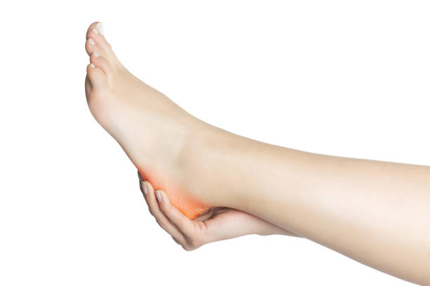 dolore al piede - podiatrist chiropractor massaging human foot foto e immagini stock