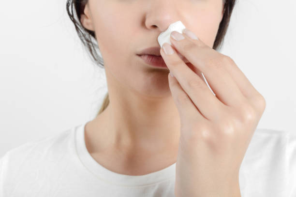 istock Young woman getting a bloody nose 934673510