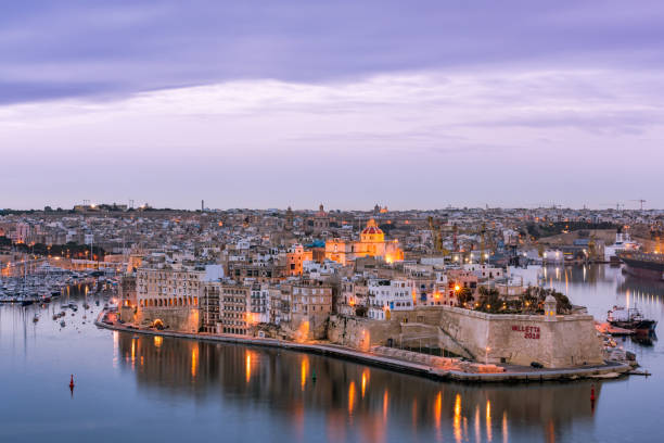 istock Illuminated skyline of Senglea at twiligh sunset,Malta 934693632