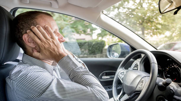 istock Stressed and annoyed male driver on the road during the rush hour 934697156