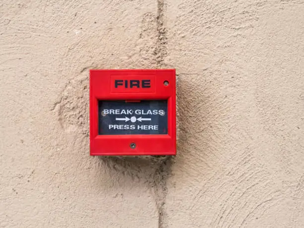 Photo of fire alarm box on cement wall for warning and security system