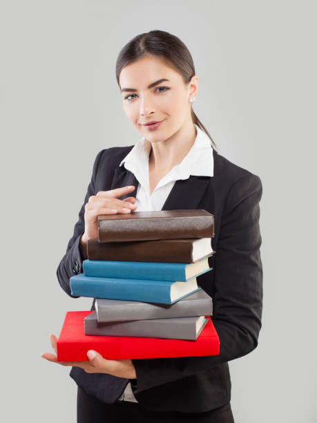 istock Young Woman Student with Book on Gray Background 934707280