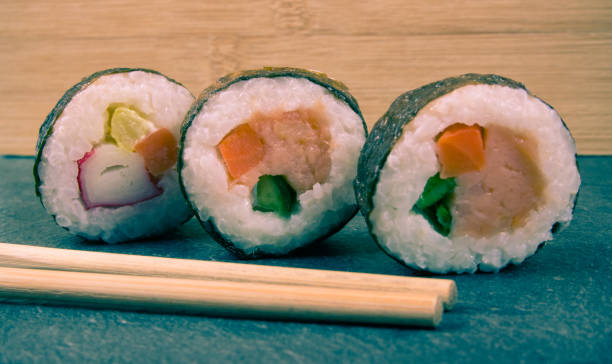 istock Various kinds of sushi on the dark background. 934707310