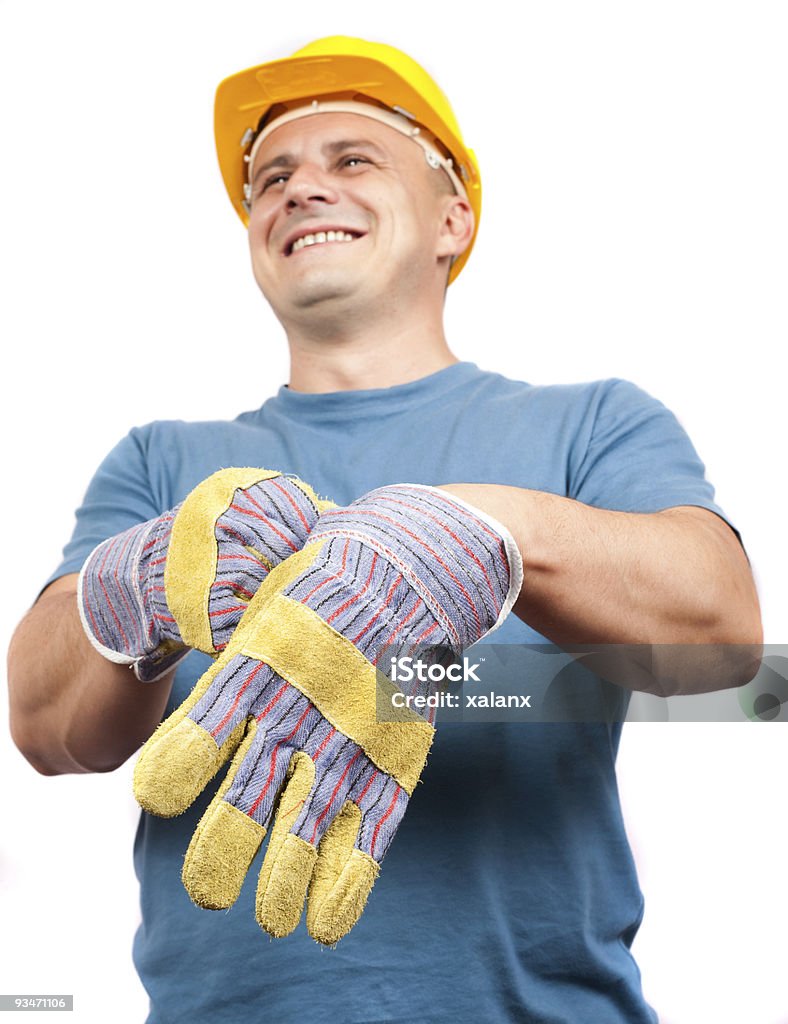 Col bleu, mettre des gants de protection en cuir - Photo de Casque libre de droits