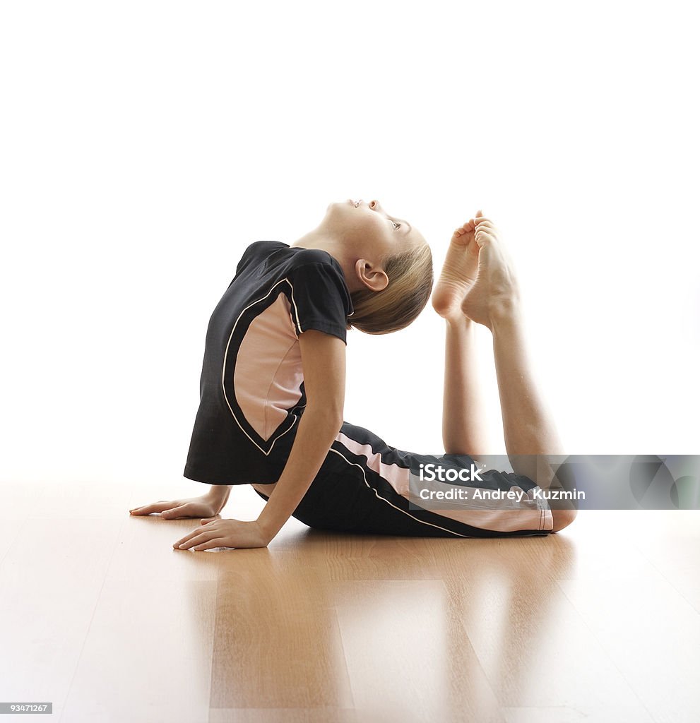 Girl making exercises on floor in bodysuit  Acrobatic Activity Stock Photo