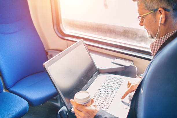 istock Businessman working and traveling by train 934717414