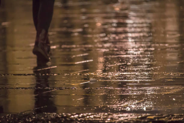 istock Girl walking in the rain 934718234
