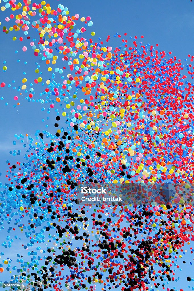Many multi colored party balloons against the blue sky. Celebration.  Balloon Stock Photo