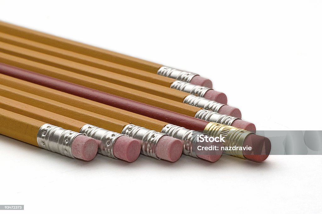 Yellow Pencils with a Different Red Pencil  Arrangement Stock Photo