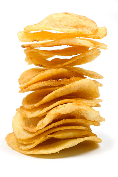 Stack of potato chips on white background stock photo