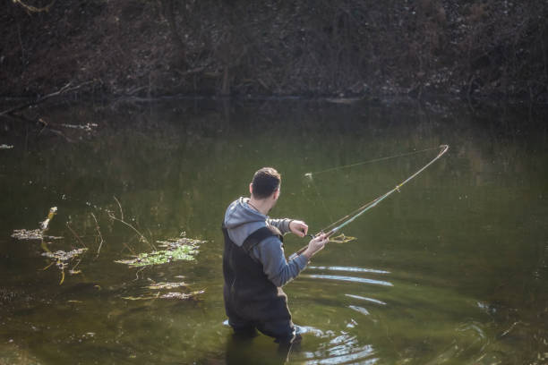 istock Fisherman in the river is fighting the fish 934765228