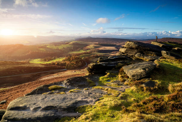 istock Hikers in stunning Peak District landscape during autumn sunset 934768636