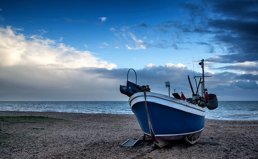 Fishing boat on beach in Hastings in East Sussex.