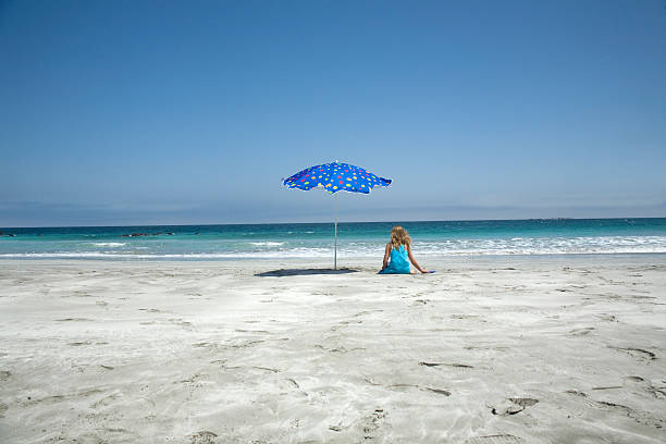 istock Girl and beach umbrella 93477524
