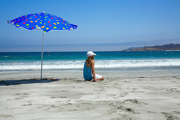 istock Girl and beach umbrella 93477525